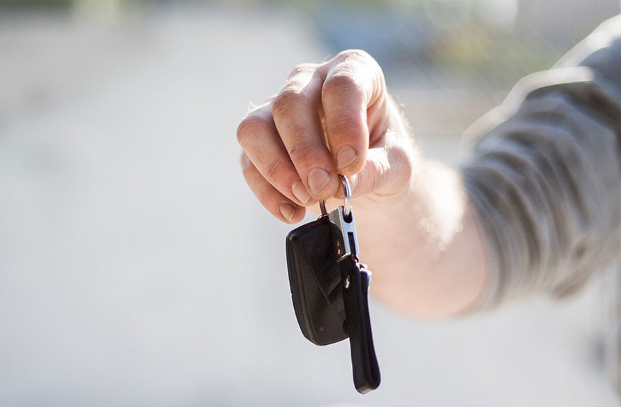 person holding car keys