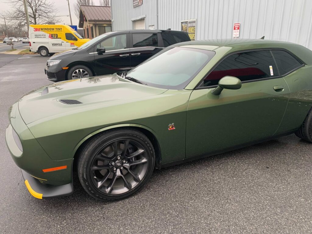 green challenger with window tint