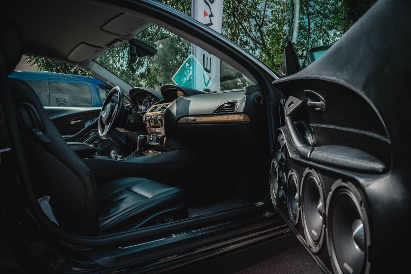 Professional car stereo system installation in the door of a vehicle.