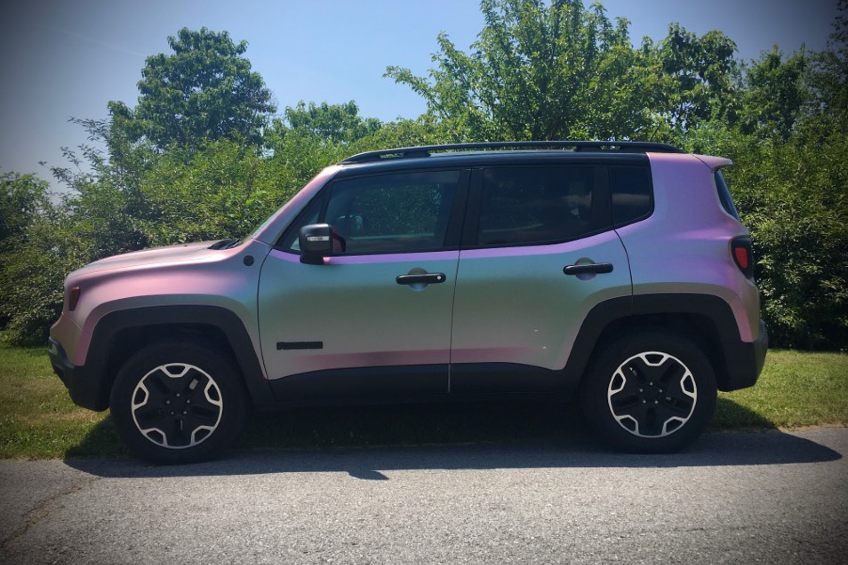 Color shifting vehicle wrap applied to the exterior of a car.