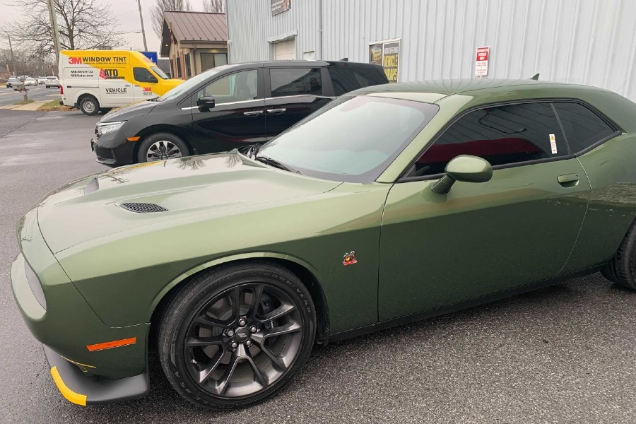 green challenger with 3m window tint